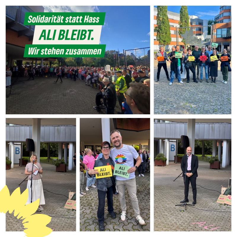 Bürgerinnen und Bürger zeigen bei einer Kundgebung vor dem Kreishaus Minden Solidarität mit Landrat Ali Doğan